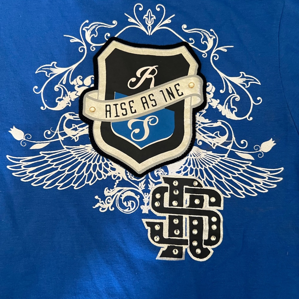 Blue Graphic Crest Tee with White Wing Design with rhinestones NWOT